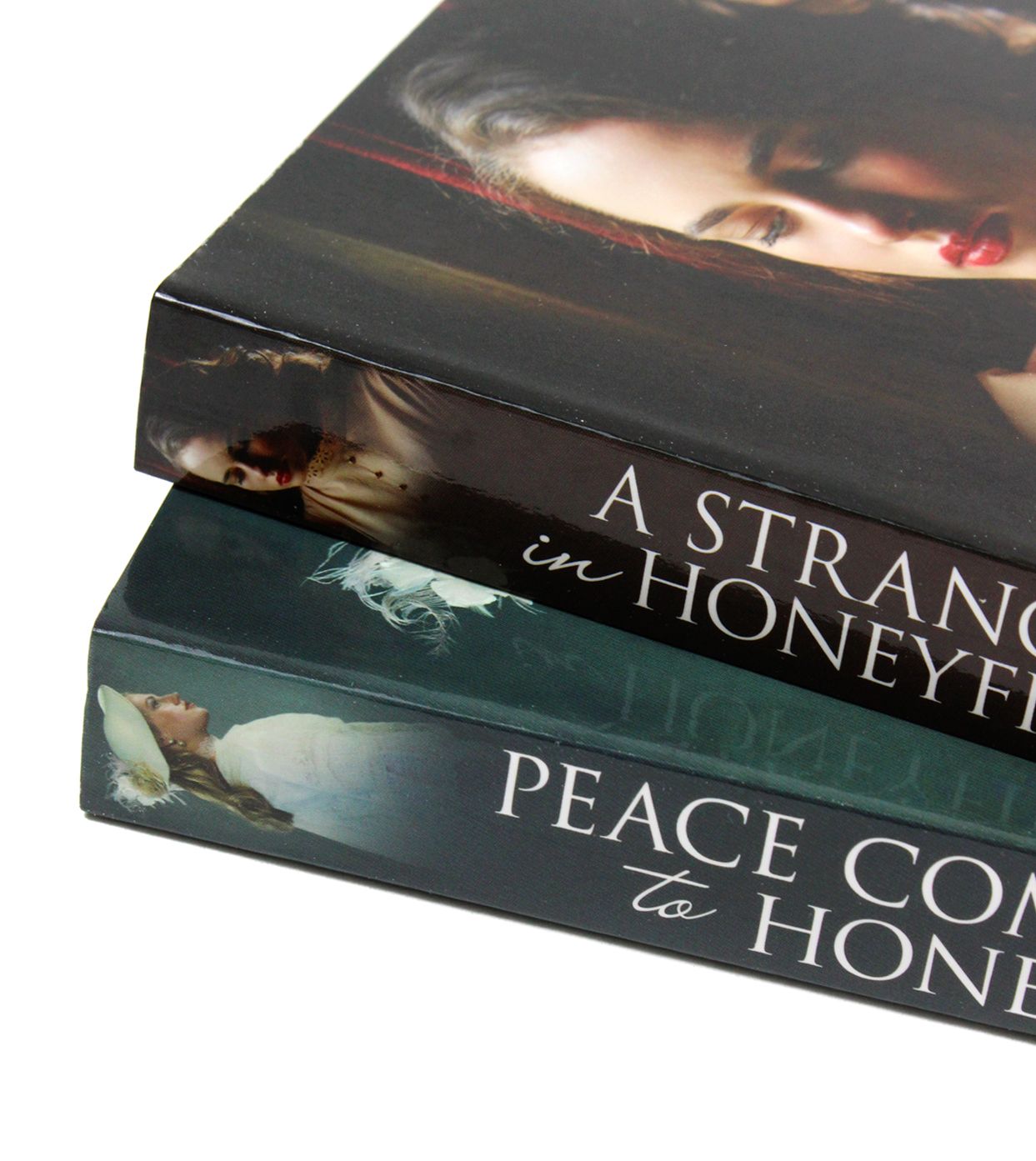 A photo of Anna Jacobs 2 Books Set (A Stranger in Honeyfield & Peace Comes to Honeyfield) on a White Background